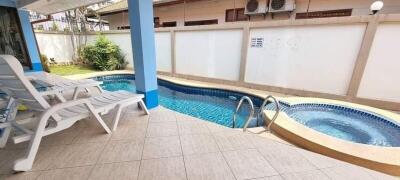 Patio with pool and sun loungers