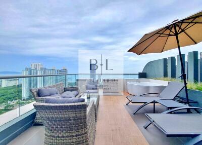 Spacious outdoor terrace with lounge furniture and city view