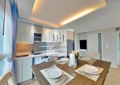Modern kitchen and dining area with elegant lighting