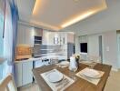 Modern kitchen and dining area with elegant lighting