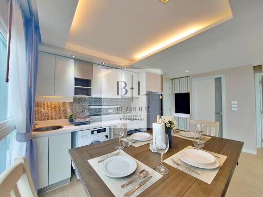 Modern kitchen and dining area with elegant lighting