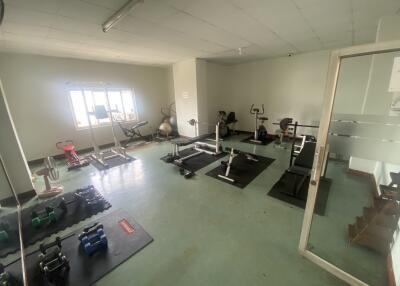 Home gym with various fitness equipment