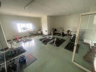 Home gym with various fitness equipment