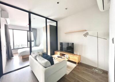 Modern living room with adjacent bedroom
