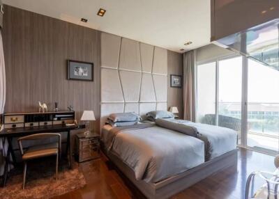 Modern bedroom with double bed and study area