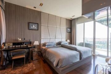 Modern bedroom with double bed and study area