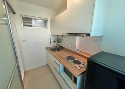 Compact kitchen with appliances and sink