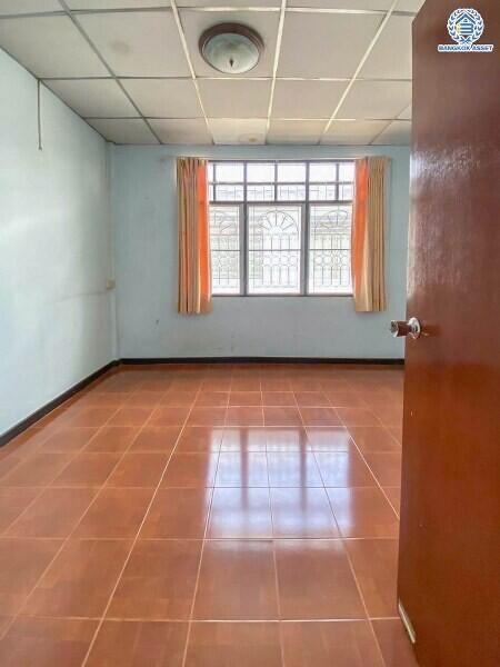 Empty bedroom with large window