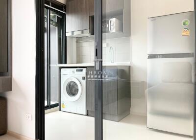 Modern kitchen with appliances and washing machine