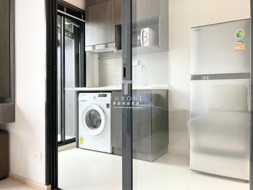 Modern kitchen with appliances and washing machine