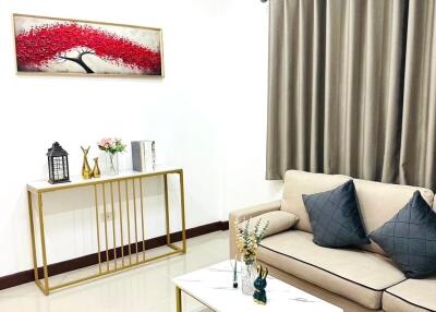 Modern living room with beige sofa and decorative elements