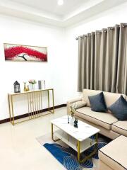 Modern living room with beige sofa and decorative elements