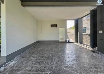 Spacious garage with tiled floor and door access