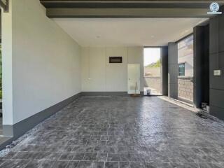 Spacious garage with tiled floor and door access