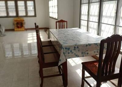 Bright dining area with a table and four chairs