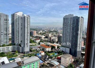 Aerial view of cityscape with tall residential and commercial buildings