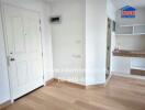 Minimalist kitchen area with wooden floor