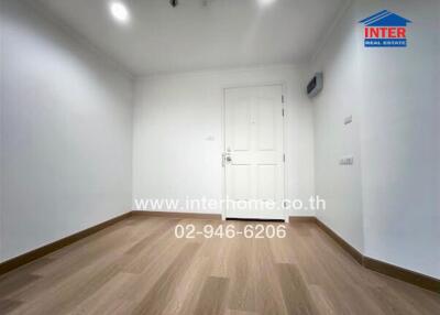 Empty bedroom with wooden flooring