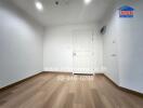 Empty bedroom with wooden flooring