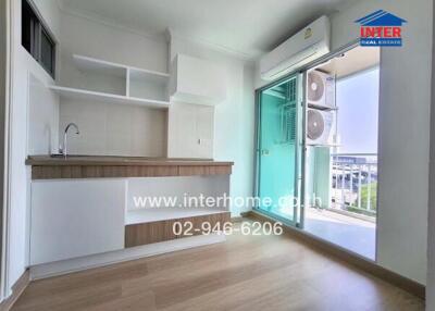 Modern kitchen with wooden cabinets, sink, large window, and air conditioning unit