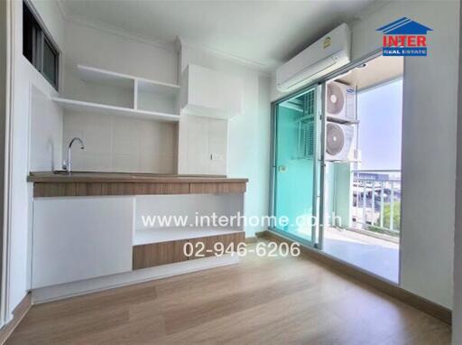 Modern kitchen with wooden cabinets, sink, large window, and air conditioning unit