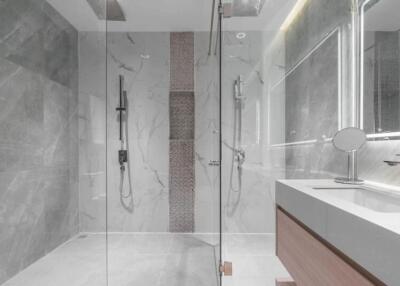 Modern bathroom with glass-enclosed shower and vanity