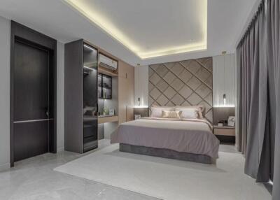 Modern bedroom with bed, nightstands, and built-in shelves