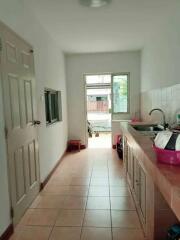 Narrow kitchen with sink and counter