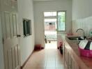 Narrow kitchen with sink and counter