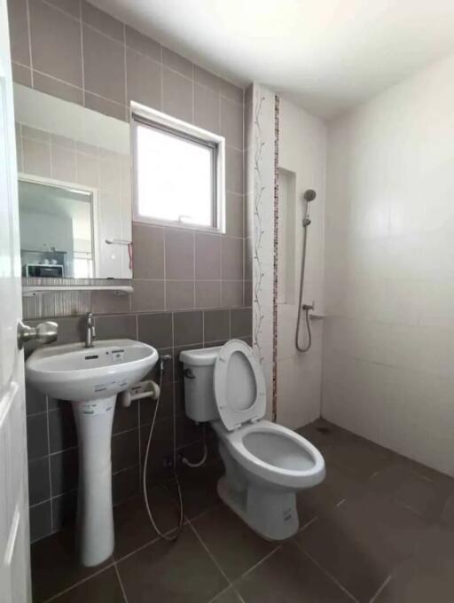 Clean modern bathroom with shower and toilet