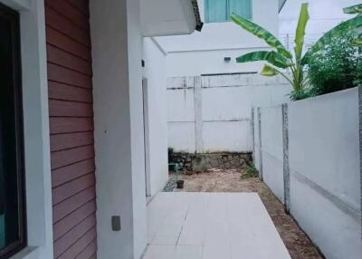 Small backyard area with tiled section