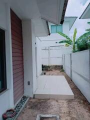 Small backyard area with tiled section