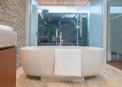 Modern bathroom with freestanding tub and glass-enclosed shower
