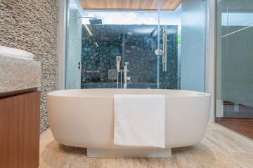 Modern bathroom with freestanding tub and glass-enclosed shower