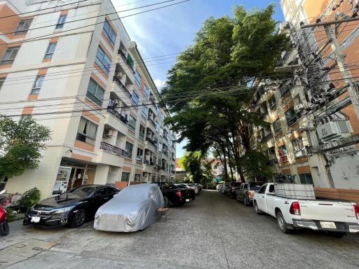 Exterior view of apartment buildings with parking area