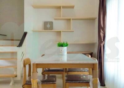 Modern dining room with wooden furniture and contemporary shelving