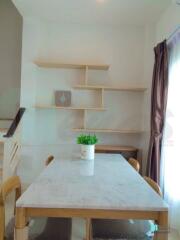 Dining area with minimalist decor and natural light