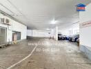 Indoor parking garage with several parked vehicles