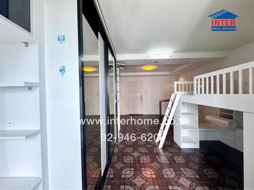 Loft bedroom with wardrobe, shelves, and unique patterned flooring