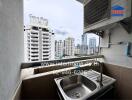 Small balcony with sink and city view