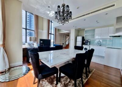 Elegant dining area with a view of the kitchen