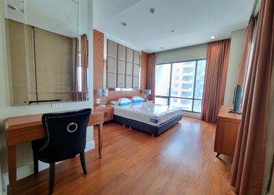 modern bedroom with large window and desk