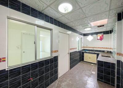 Spacious modern kitchen with black and white tile design