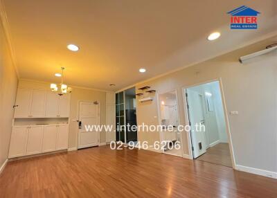 Spacious living room with wooden flooring and modern fixtures