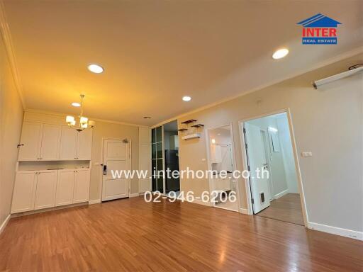 Spacious living room with wooden flooring and modern fixtures