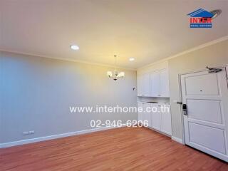 Bright living area with wooden floor and chandelier