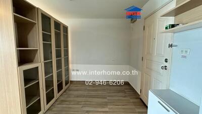 Bedroom with built-in wooden cabinets and white door