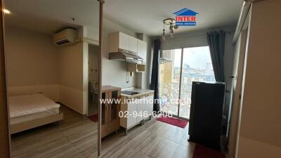 Modern studio apartment with kitchenette and city view