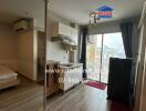 Modern studio apartment with kitchenette and city view