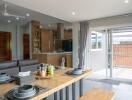 Modern open-plan dining area and kitchen with natural light